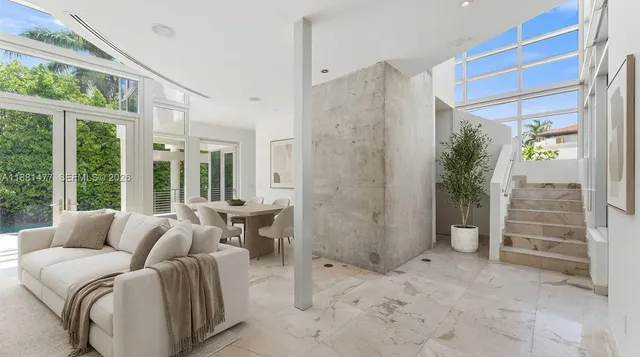 a living room with furniture and windows