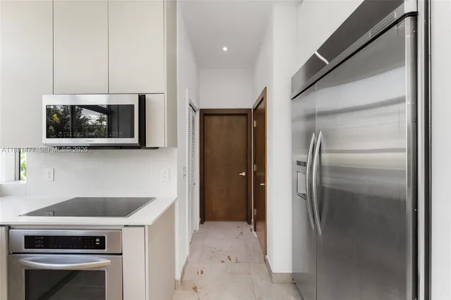 a view of a bathroom from a hallway