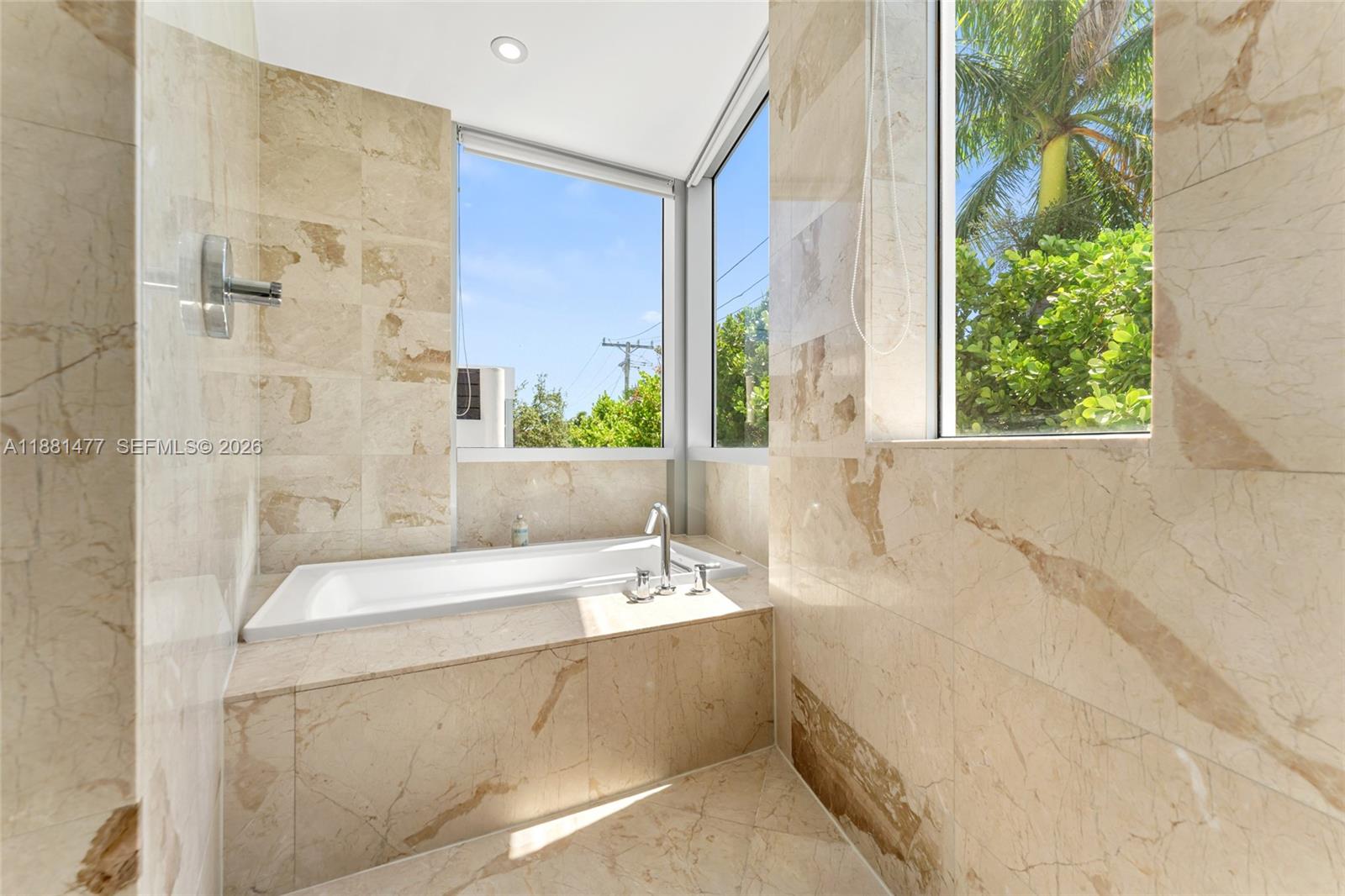 544 Fernwood Road, Unit 544 Key Biscayne, FL 33149 - Photo 25 of 35 a bathroom with a bathtub and a sink