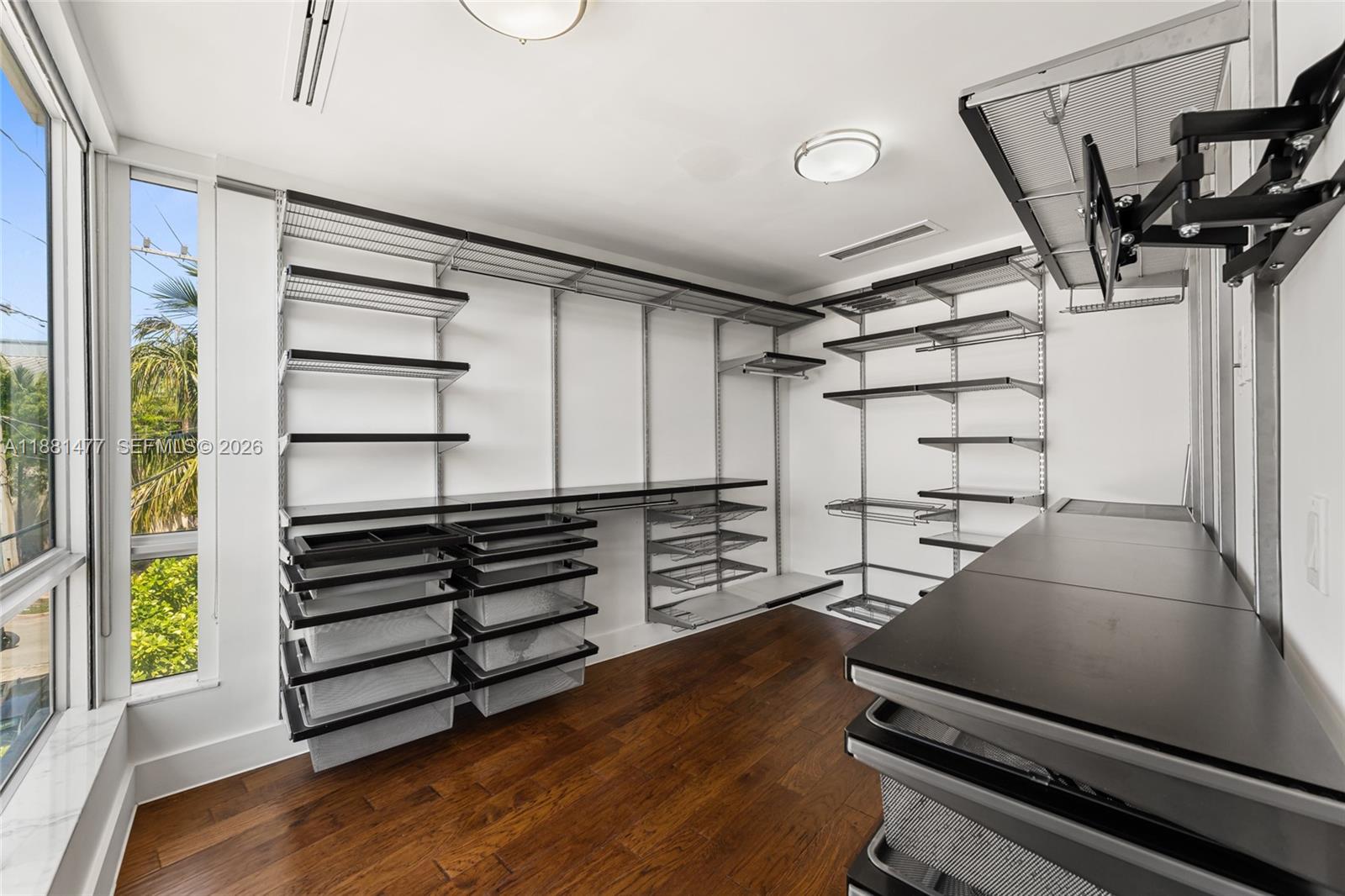 544 Fernwood Road, Unit 544 Key Biscayne, FL 33149 - Photo 27 of 35 a view of a room with racks on the wall