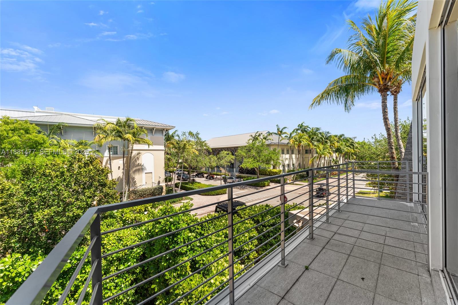 544 Fernwood Road, Unit 544 Key Biscayne, FL 33149 - Photo 31 of 35 a view of a pathway with a wrought fence