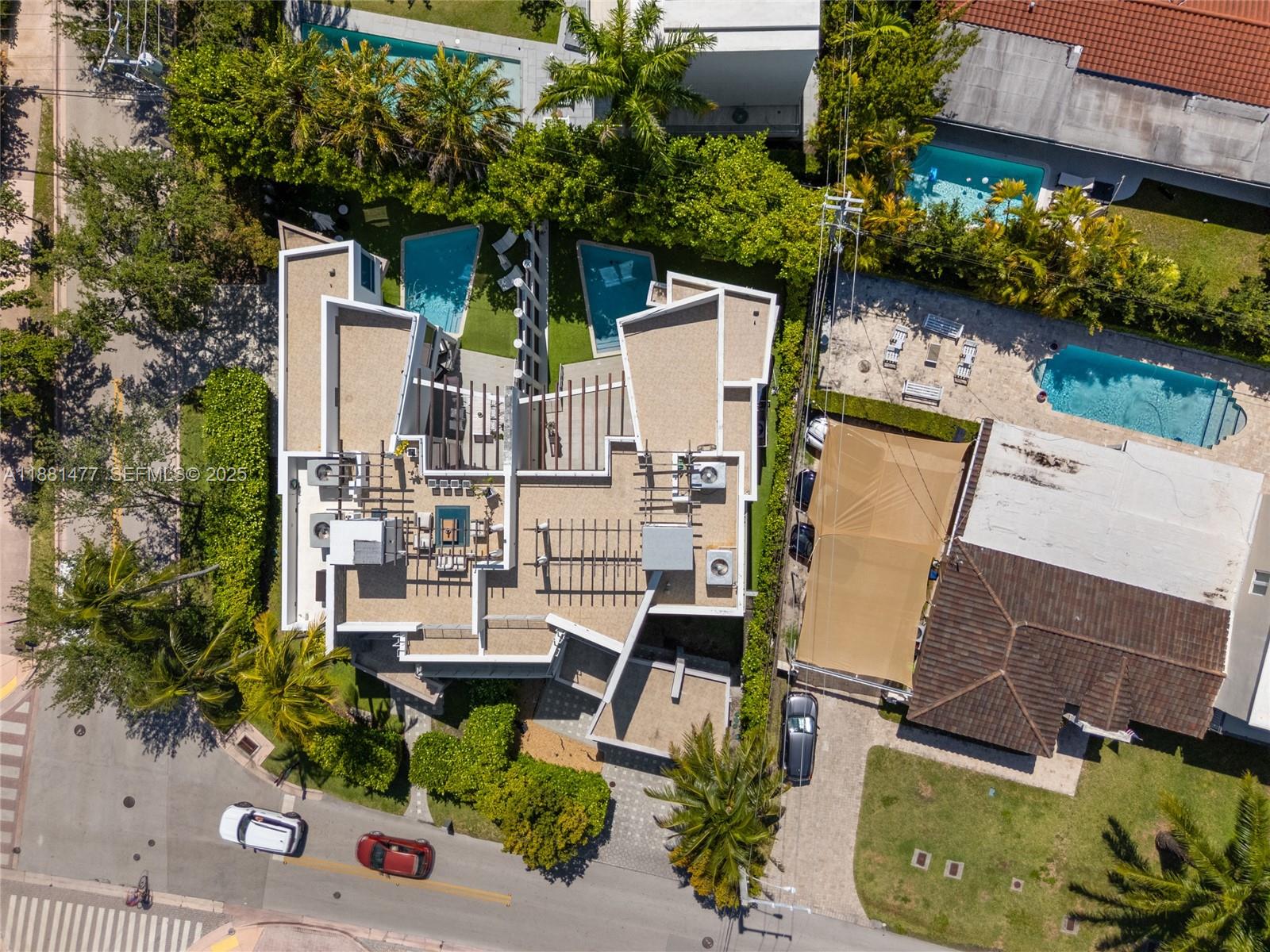 544 Fernwood Road, Unit 544 Key Biscayne, FL 33149 - Photo 34 of 42 an aerial view of a house with a yard and potted plants