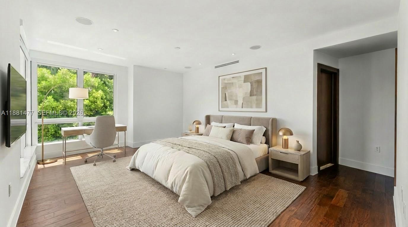 544 Fernwood Road, Unit 544 Key Biscayne, FL 33149 - Photo 6 of 35 a bedroom with a bed and a large window