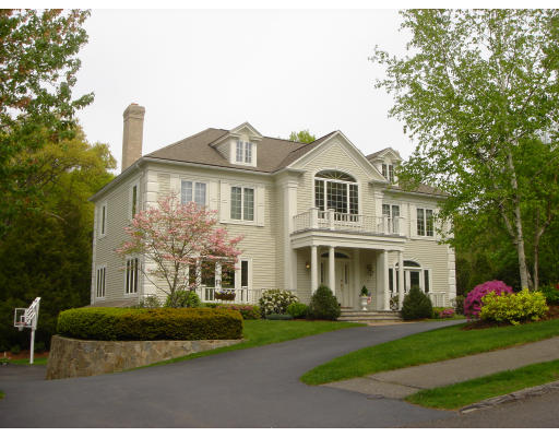 55 Cranmore Road Wellesley, MA 02481 - Photo 1 of 17 a front view of a house with a garden and plants