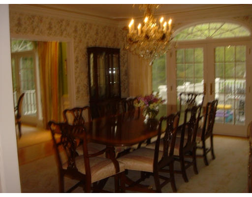 55 Cranmore Road Wellesley, MA 02481 - Photo 5 of 17 a view of a dining room with furniture and chandelier