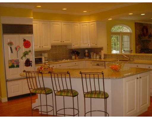 55 Cranmore Road Wellesley, MA 02481 - Photo 9 of 17 a view of a kitchen with a sink and cabinets