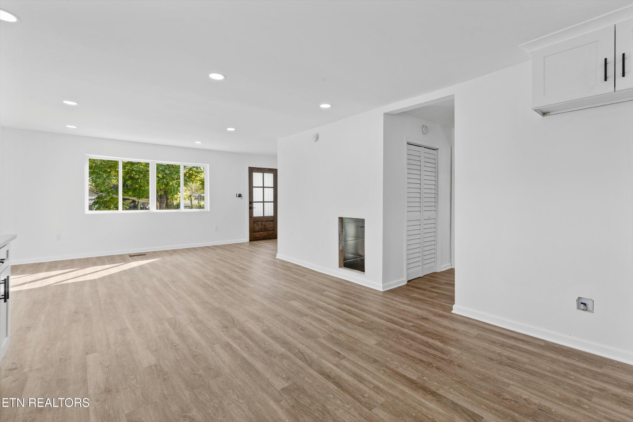 2399 Sweetwater Vonore Road Sweetwater, TN 37874 - Photo 11 of 26 an empty room with wooden floor and windows