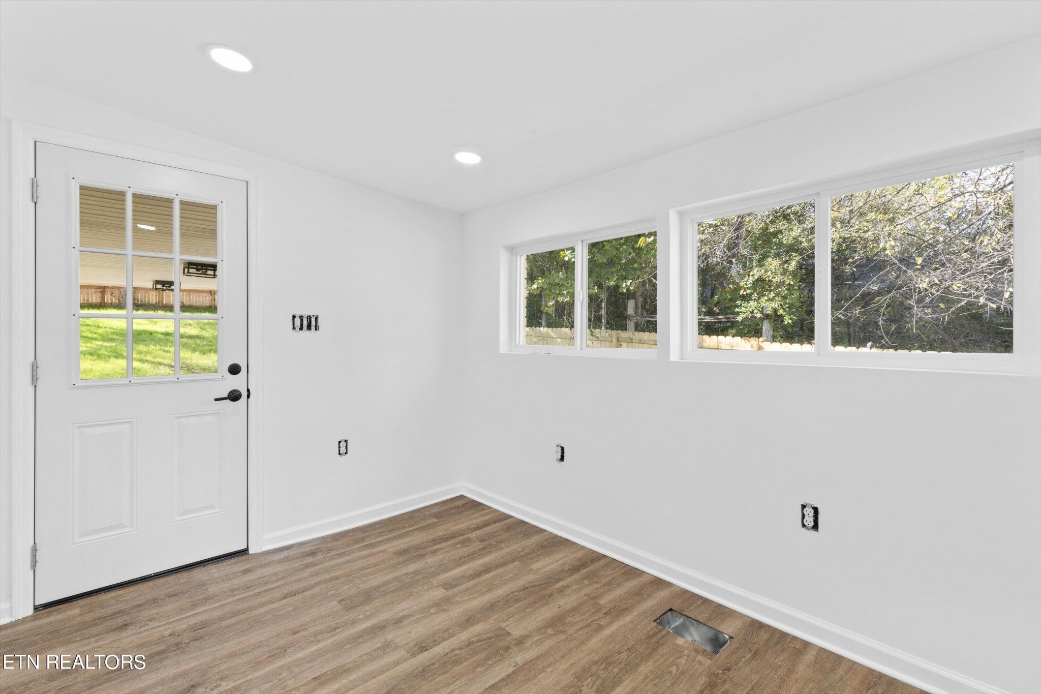 2399 Sweetwater Vonore Road Sweetwater, TN 37874 - Photo 13 of 26 an empty room with wooden floor and windows