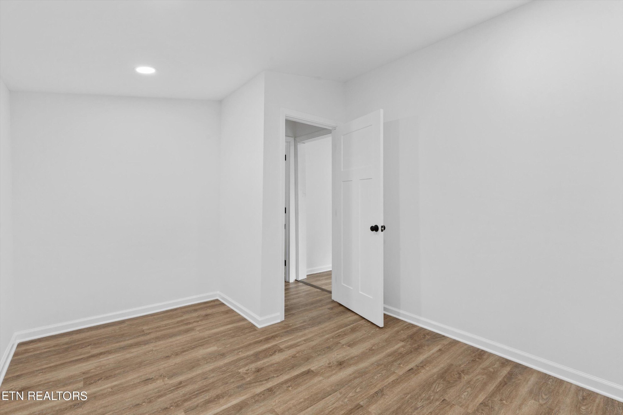 2399 Sweetwater Vonore Road Sweetwater, TN 37874 - Photo 19 of 26 a view of an empty room with wooden floor