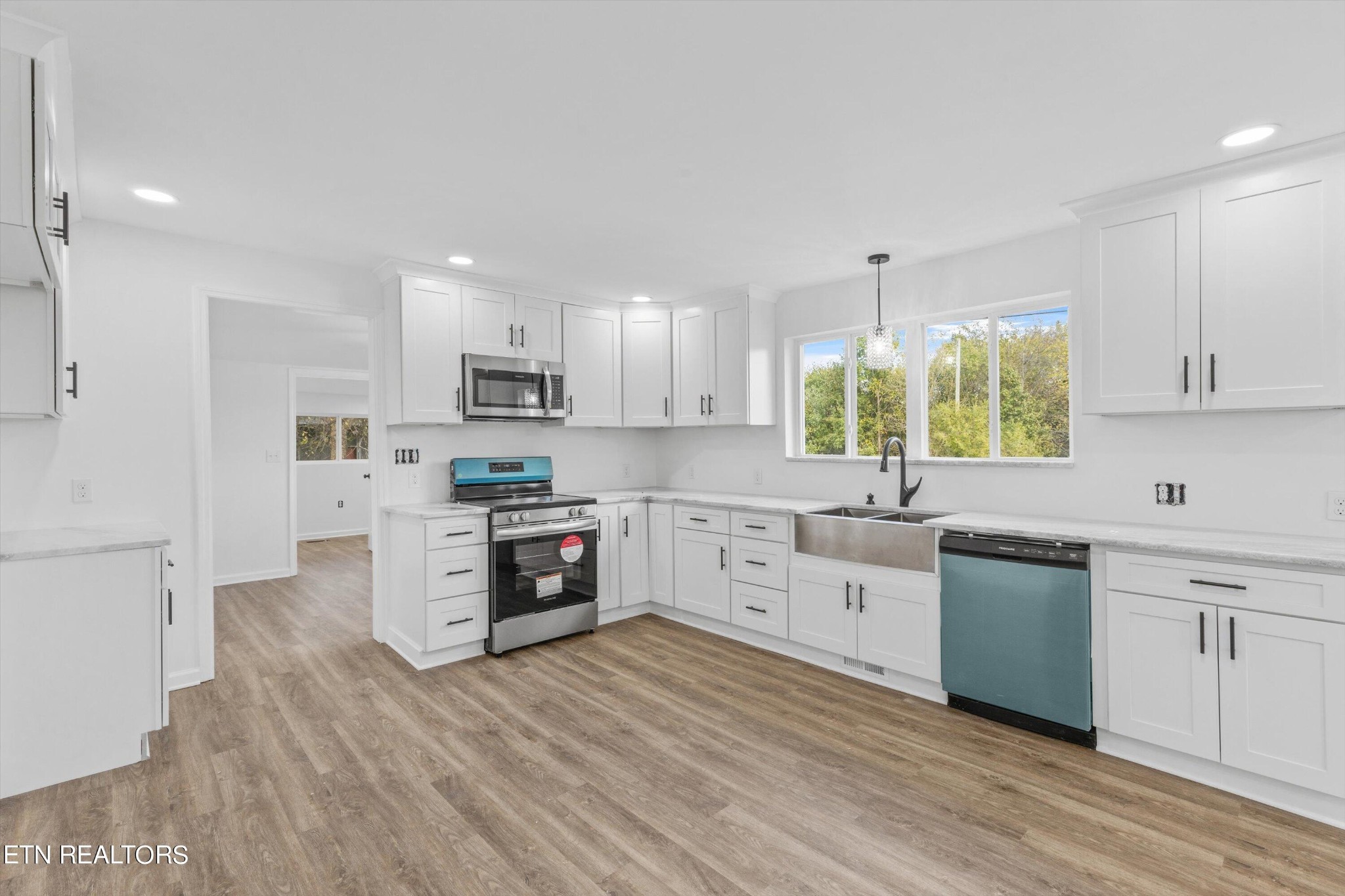 2399 Sweetwater Vonore Road Sweetwater, TN 37874 - Photo 2 of 26 a kitchen with granite countertop white cabinets and white appliances