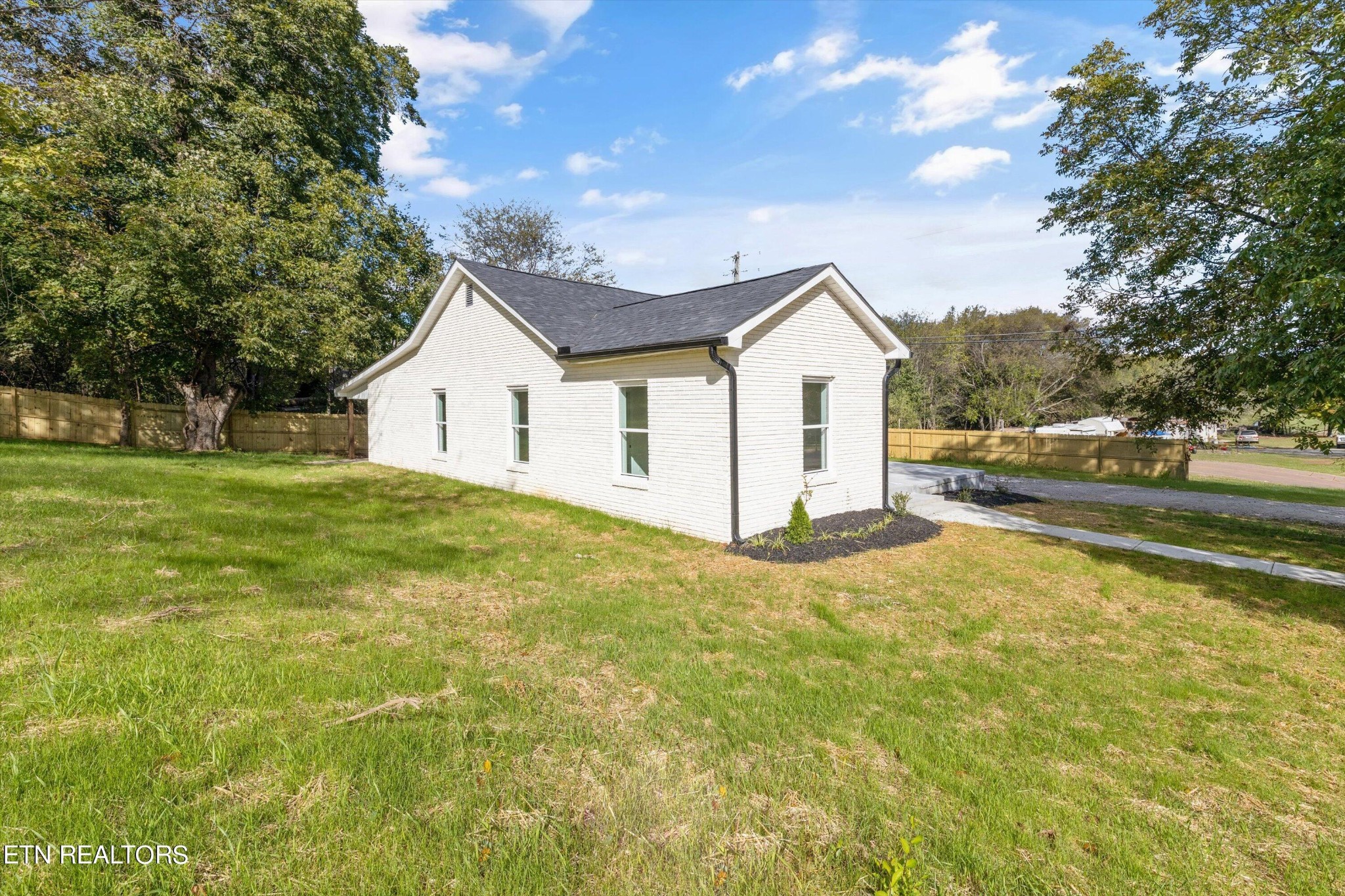 2399 Sweetwater Vonore Road Sweetwater, TN 37874 - Photo 3 of 26 a view of a house with a yard and garage