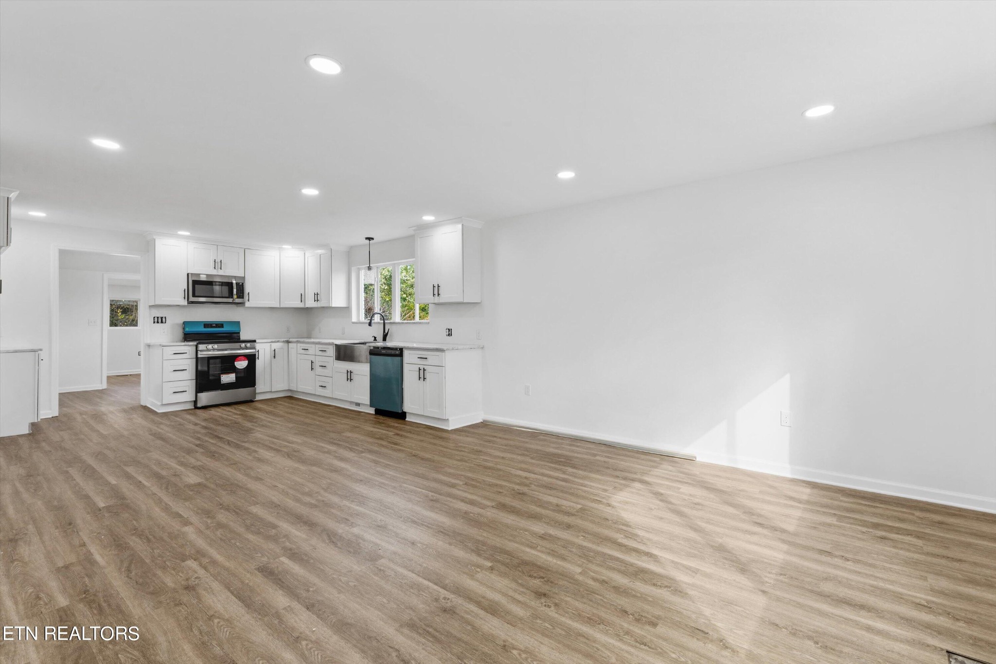 2399 Sweetwater Vonore Road Sweetwater, TN 37874 - Photo 6 of 26 a view of kitchen with kitchen island microwave and cabinets