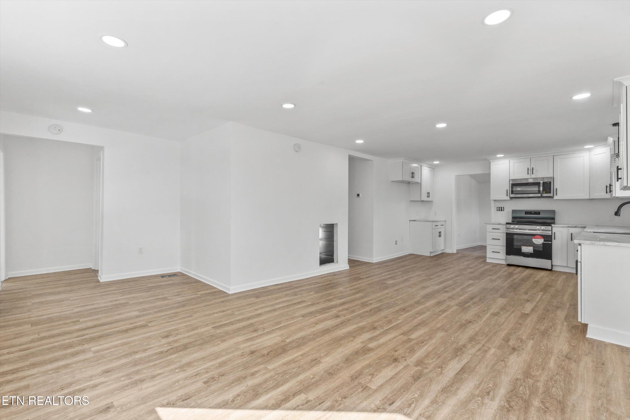 2399 Sweetwater Vonore Road Sweetwater, TN 37874 - Photo 7 of 26 a view of an empty room with kitchen and window