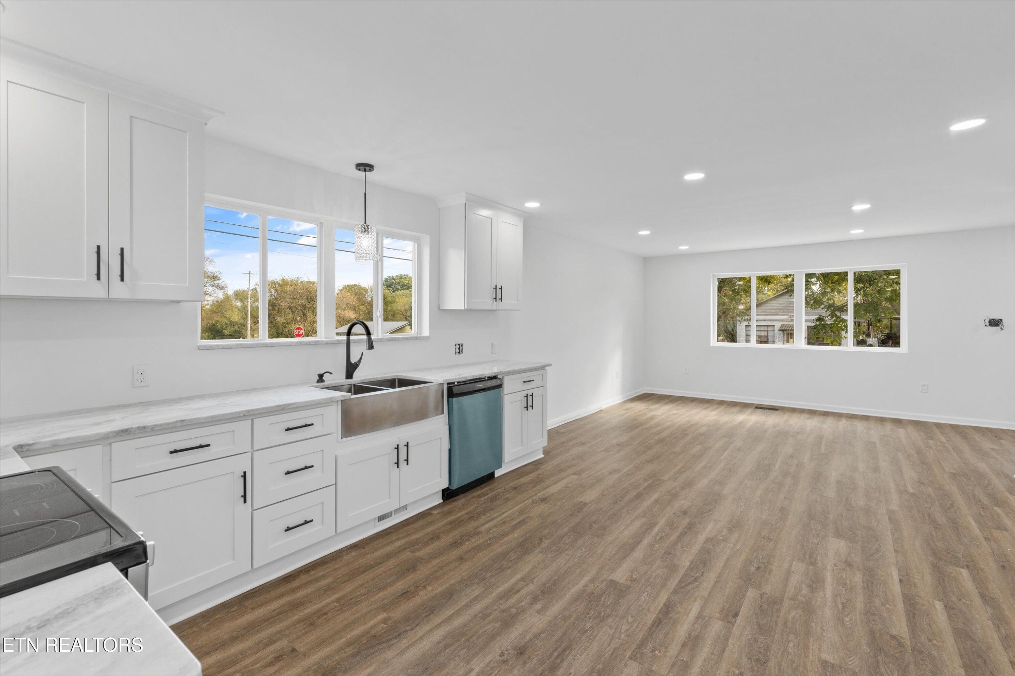 2399 Sweetwater Vonore Road Sweetwater, TN 37874 - Photo 9 of 26 a large white kitchen with cabinets a sink and appliances