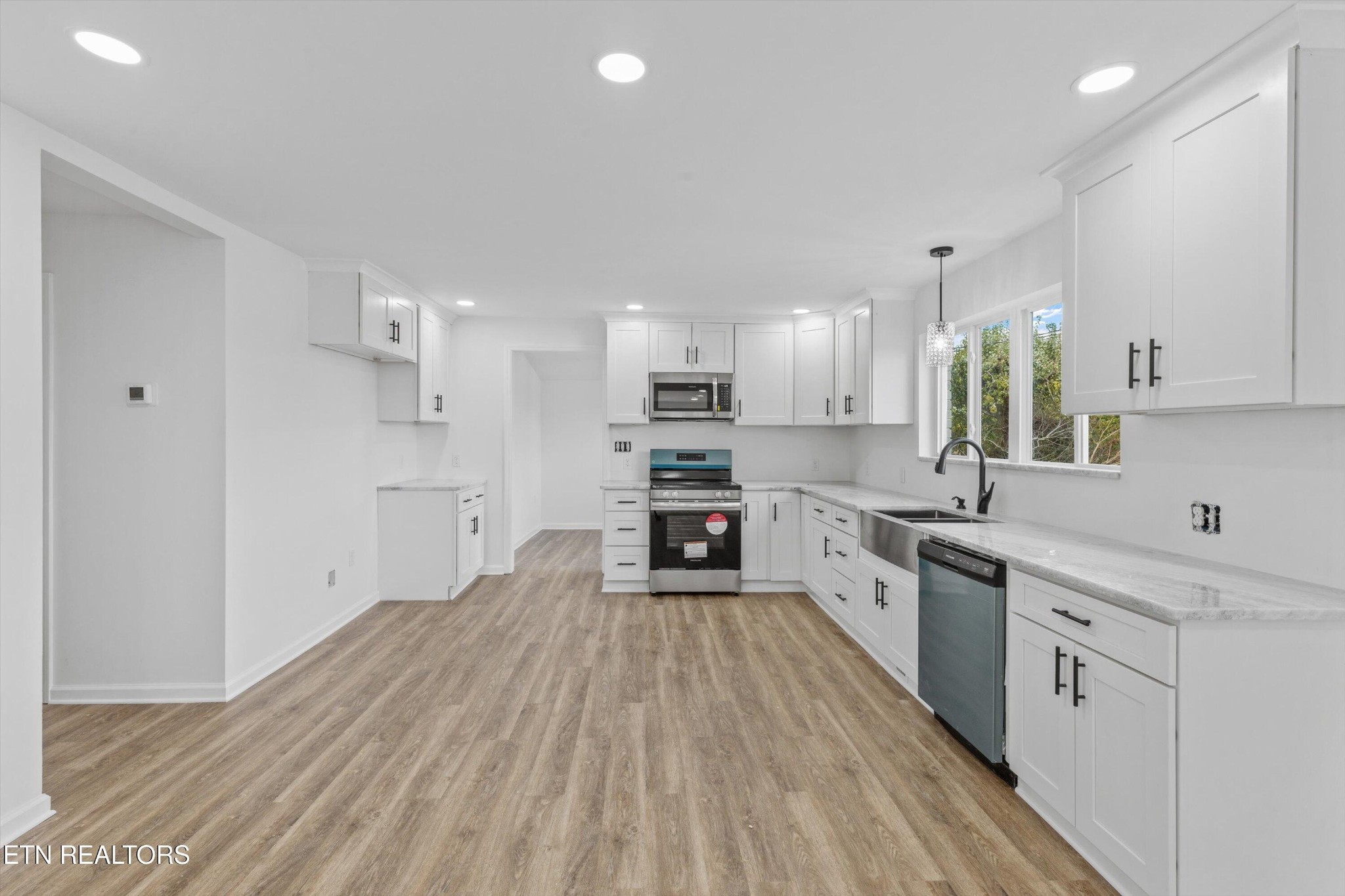 2399 Sweetwater Vonore Road Sweetwater, TN 37874 - Photo 10 of 26 a large kitchen with a lot of counter space and wooden floor