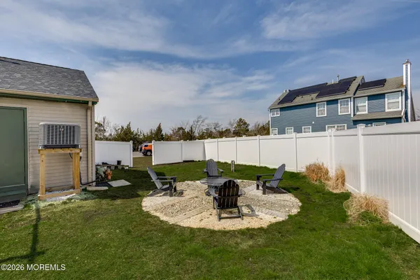 a front view of a house with a garden and yard