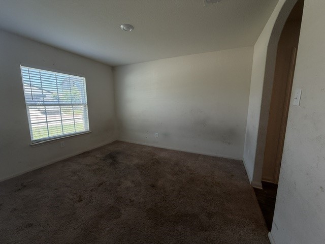 124 Niven Path Jarrell, TX 76537 - Photo 2 of 15 an empty room with a empty space and windows