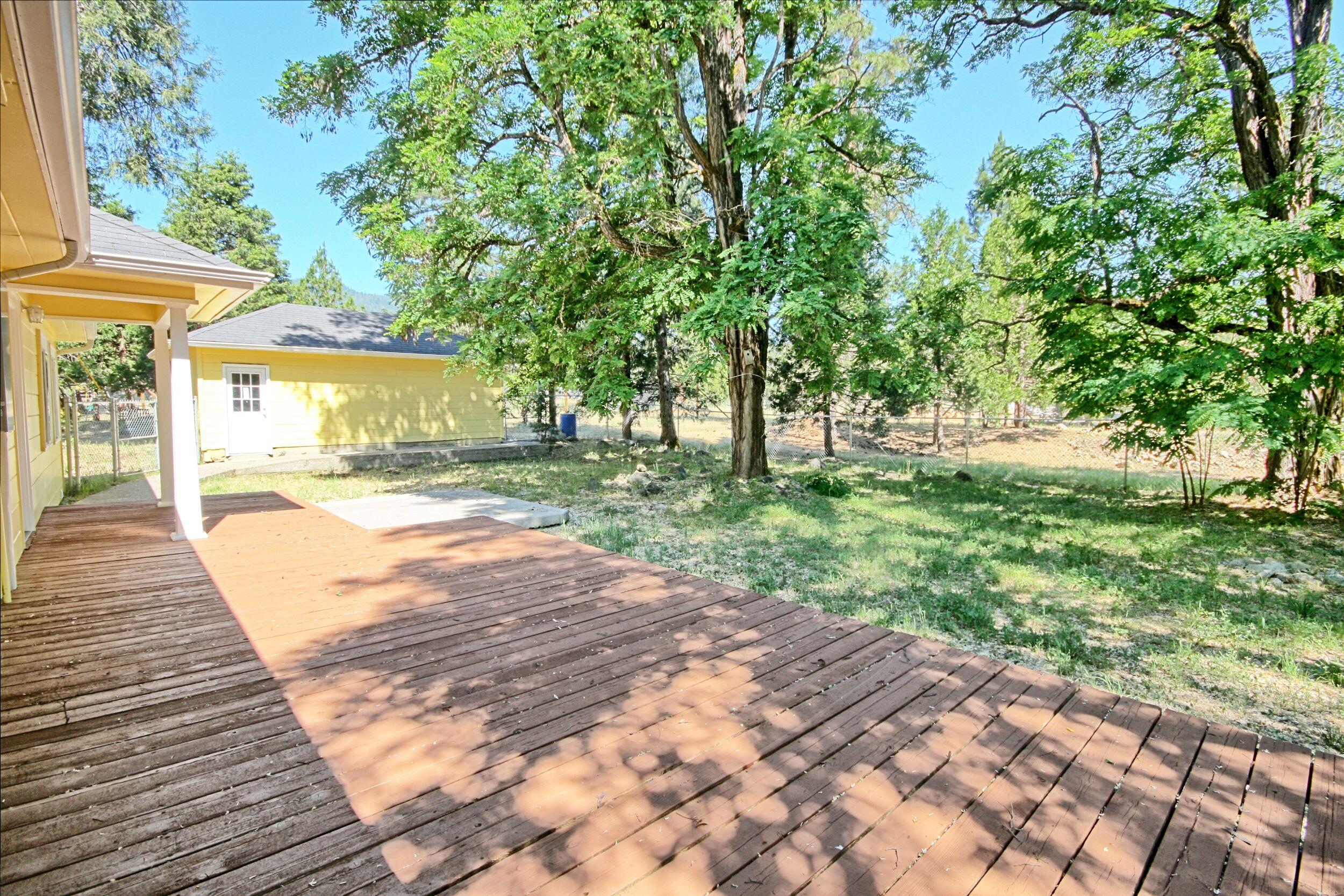 199 Powell Creek Road Williams, OR 97544 - Photo 38 of 57 a view of a backyard with a garden