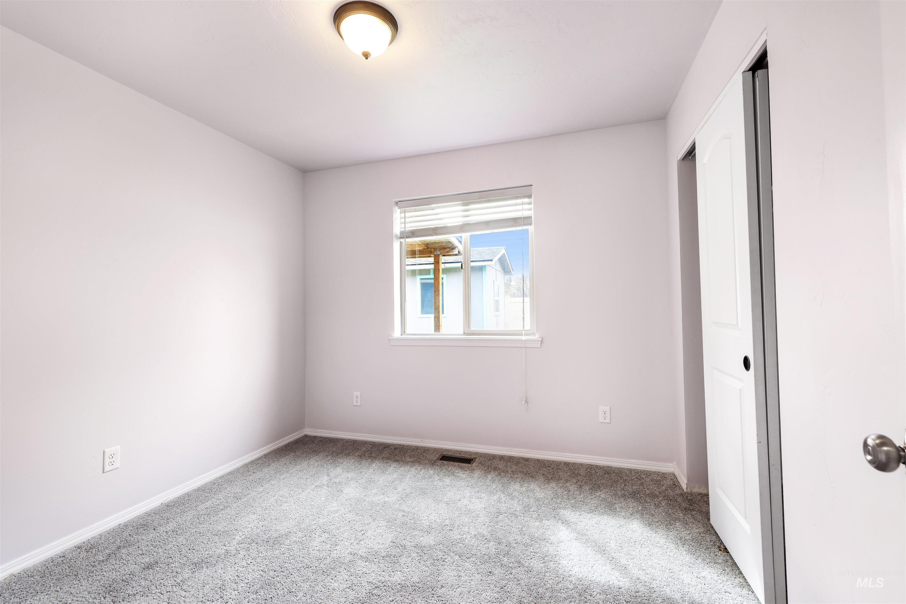356 Watchmaker Street Twin Falls, ID 83301 - Photo 15 of 22 Unfurnished bedroom featuring light carpet and a closet