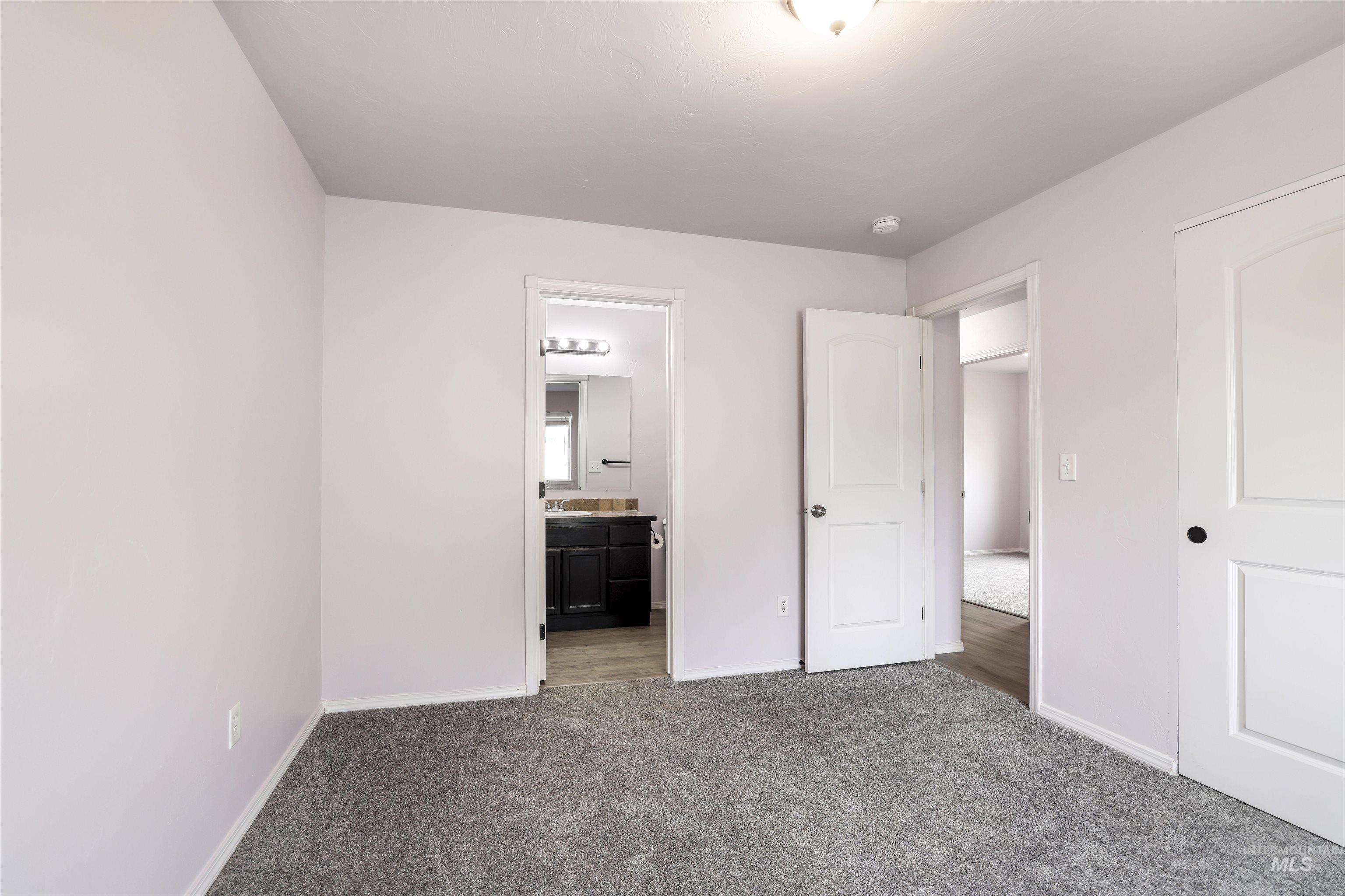 356 Watchmaker Street Twin Falls, ID 83301 - Photo 19 of 22 Unfurnished bedroom with carpet and ensuite bath