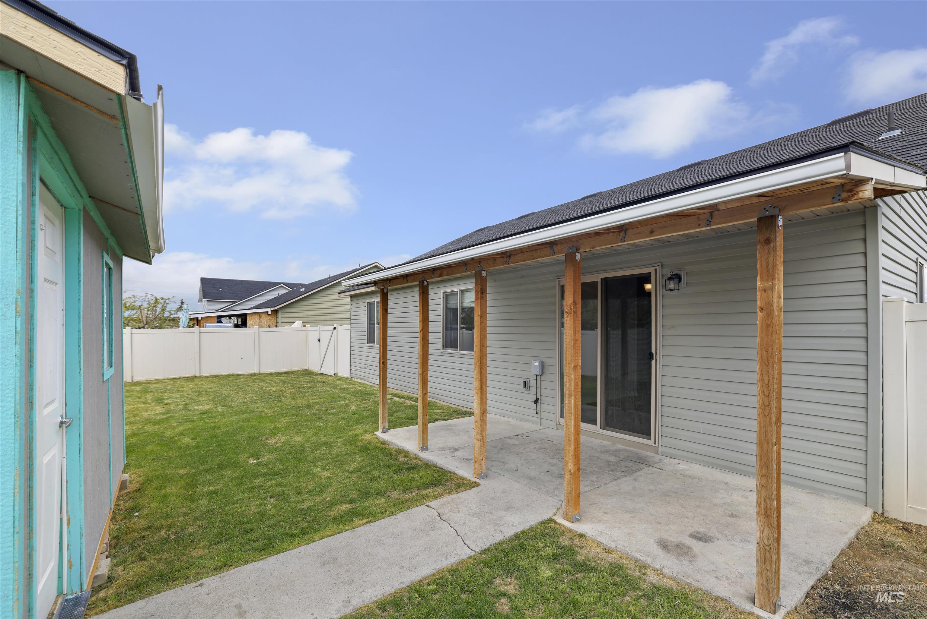356 Watchmaker Street Twin Falls, ID 83301 - Photo 20 of 22 Back of property with a fenced backyard, a patio, and a shingled roof