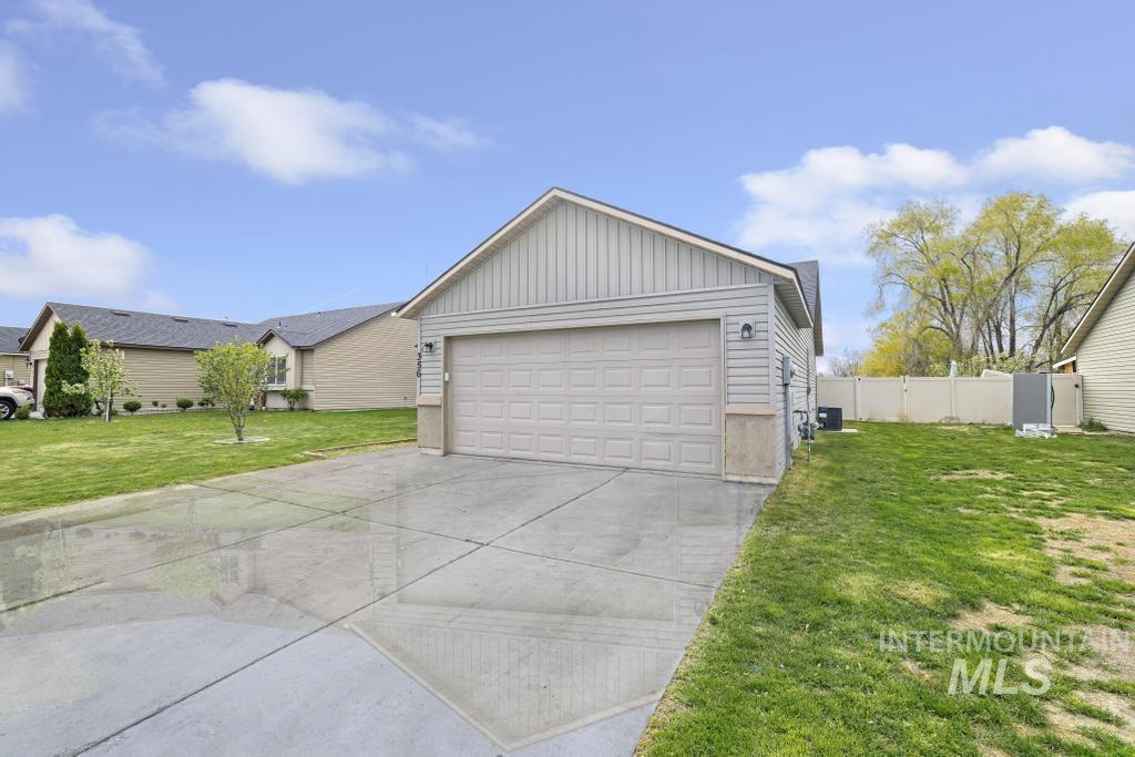 356 Watchmaker Street Twin Falls, ID 83301 - Photo 2 of 22 Garage featuring driveway