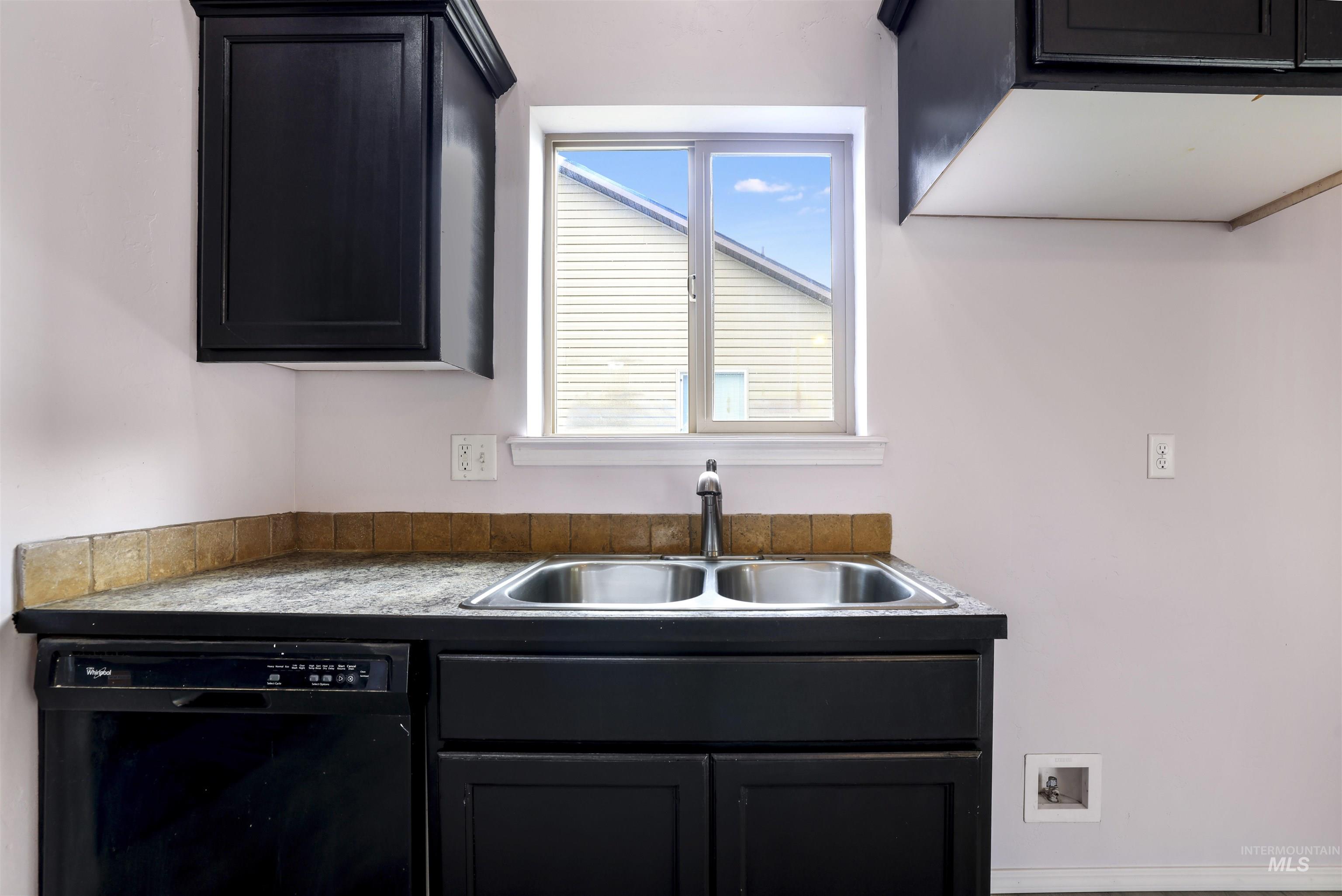 356 Watchmaker Street Twin Falls, ID 83301 - Photo 9 of 22 Kitchen featuring dark cabinets and black dishwasher