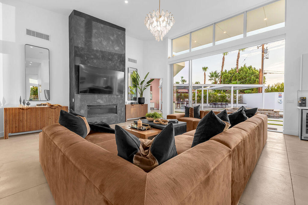 2100 East Sahara Road Palm Springs, CA 92262 - Photo 111 of 117 a living room with furniture and a large window