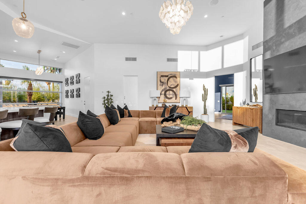 2100 East Sahara Road Palm Springs, CA 92262 - Photo 116 of 117 a living room with furniture kitchen view and a large window