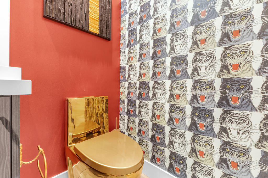 2100 East Sahara Road Palm Springs, CA 92262 - Photo 19 of 117 a white toilet sitting next to a shower curtain