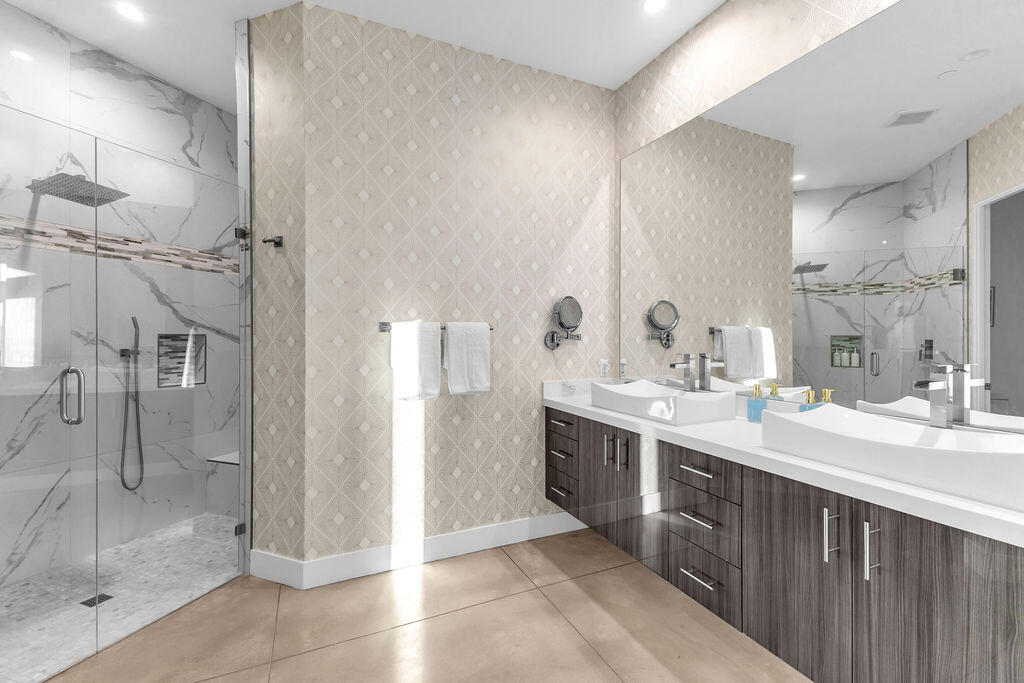 2100 East Sahara Road Palm Springs, CA 92262 - Photo 25 of 117 a bathroom with a double vanity sink mirror and shower