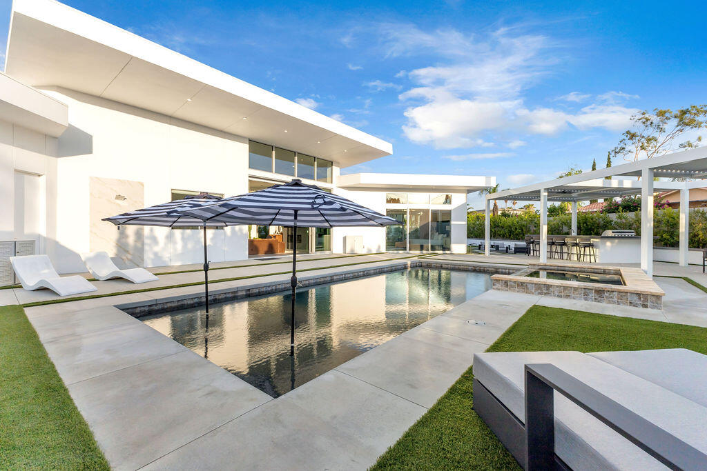 2100 East Sahara Road Palm Springs, CA 92262 - Photo 34 of 117 a view of a swimming pool with a patio
