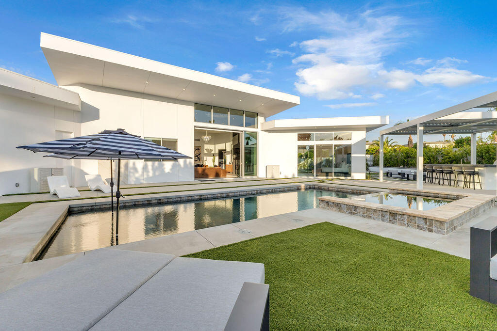 2100 East Sahara Road Palm Springs, CA 92262 - Photo 40 of 117 a view of a house with a swimming pool