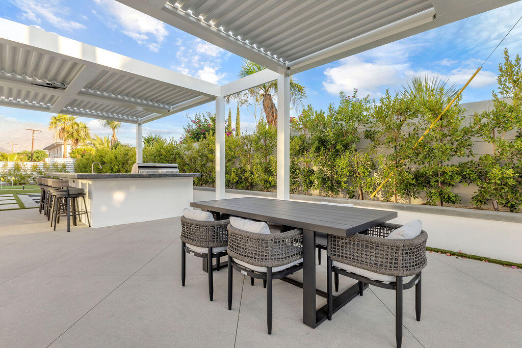 2100 East Sahara Road Palm Springs, CA 92262 - Photo 41 of 117 a view of an outdoor sitting area with furniture
