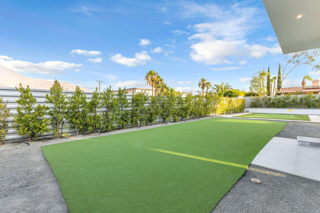 2100 East Sahara Road Palm Springs, CA 92262 - Photo 51 of 117 a view of a golf course with a lake