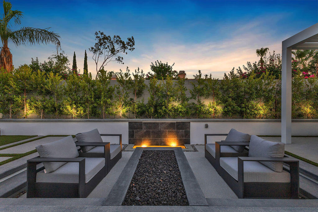 2100 East Sahara Road Palm Springs, CA 92262 - Photo 74 of 117 a view of a chairs and table on the terrace