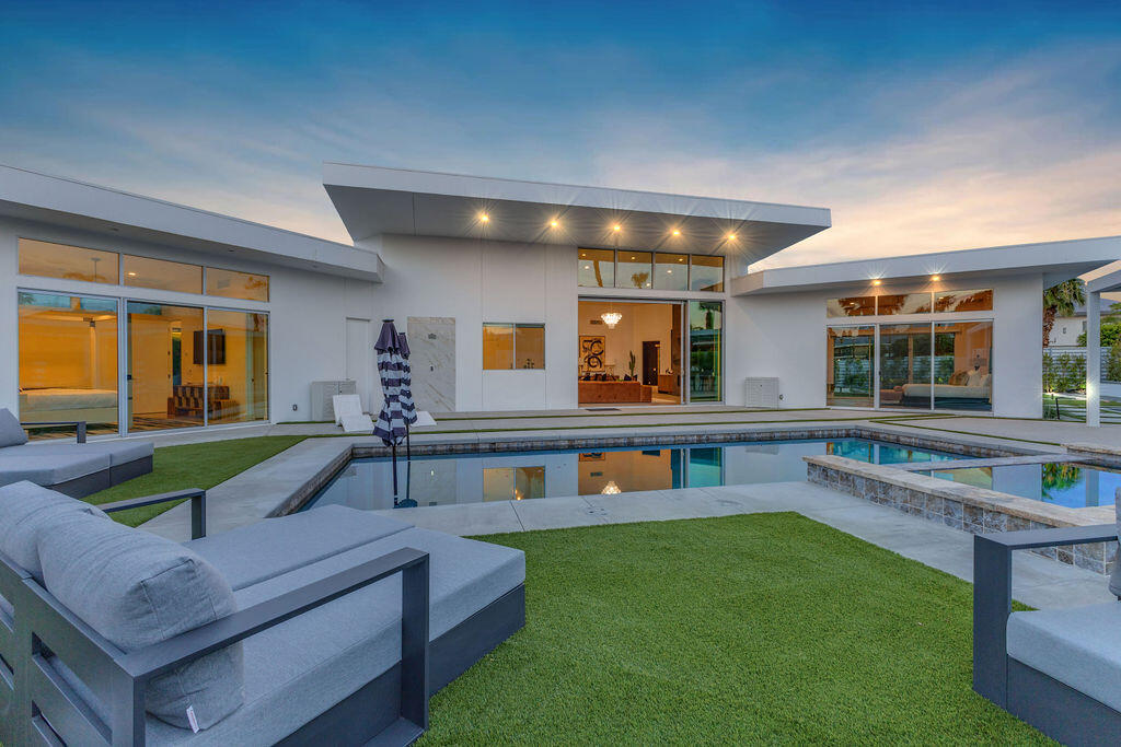 2100 East Sahara Road Palm Springs, CA 92262 - Photo 89 of 117 a living room with furniture and a wooden floor