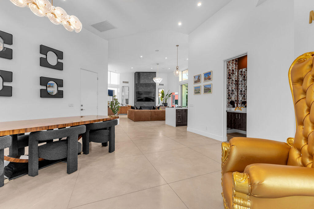 2100 East Sahara Road Palm Springs, CA 92262 - Photo 98 of 117 a living room with furniture and a flat screen tv