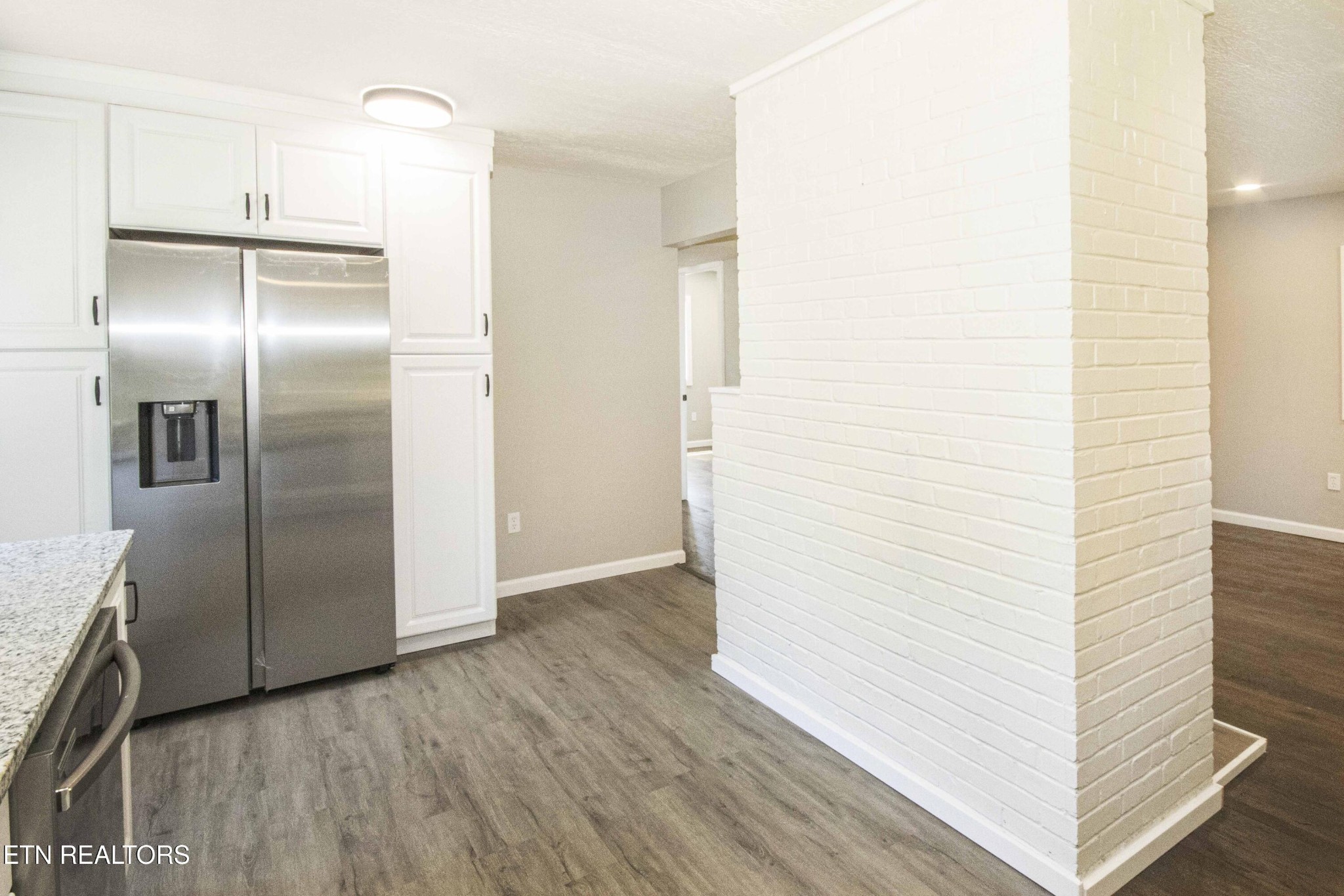 110 Delmar Circle Oak Ridge, TN 37830 - Photo 14 of 38 a view of a refrigerator in kitchen and an empty room
