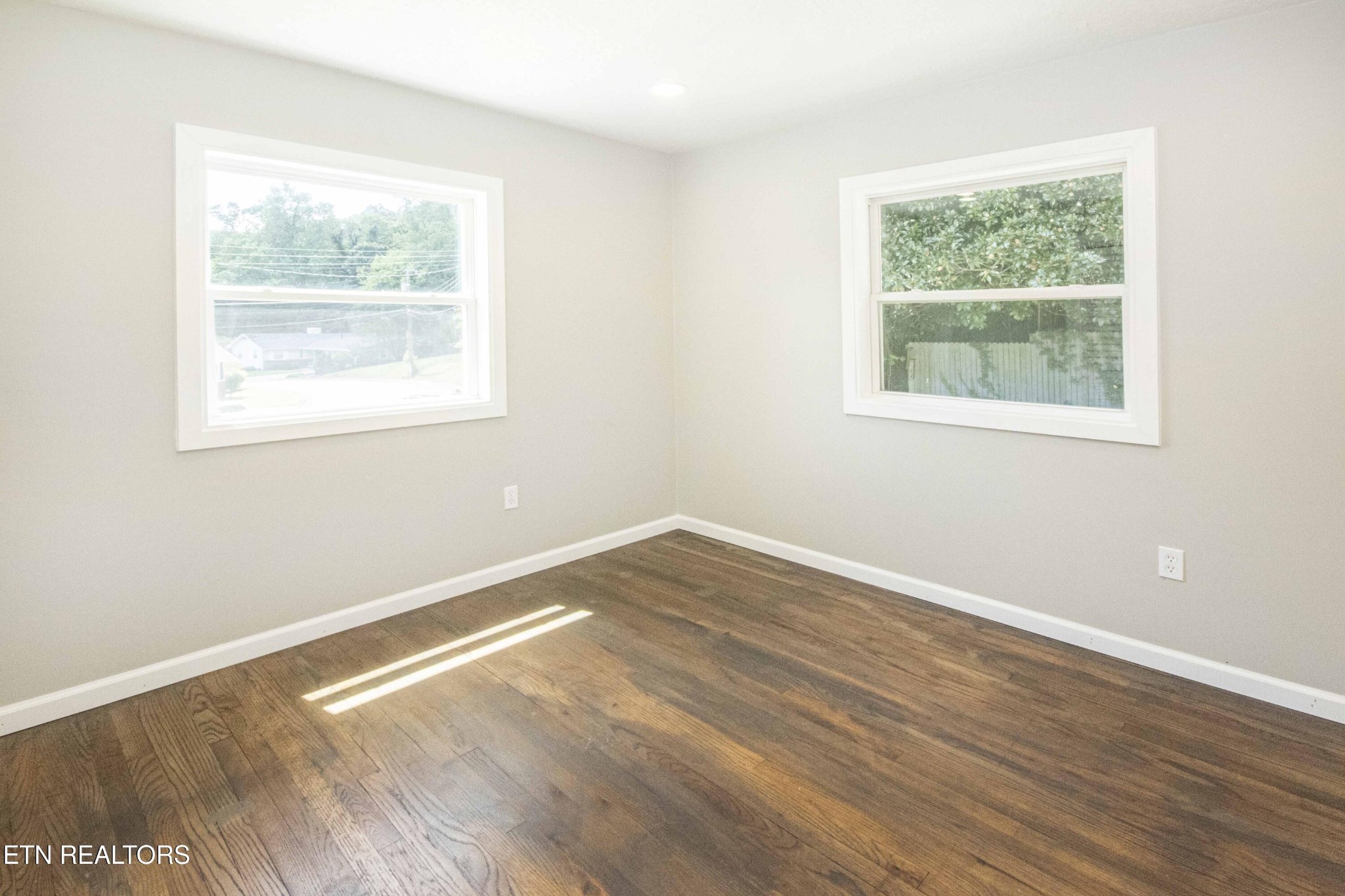 110 Delmar Circle Oak Ridge, TN 37830 - Photo 18 of 38 an empty room with wooden floor and a window