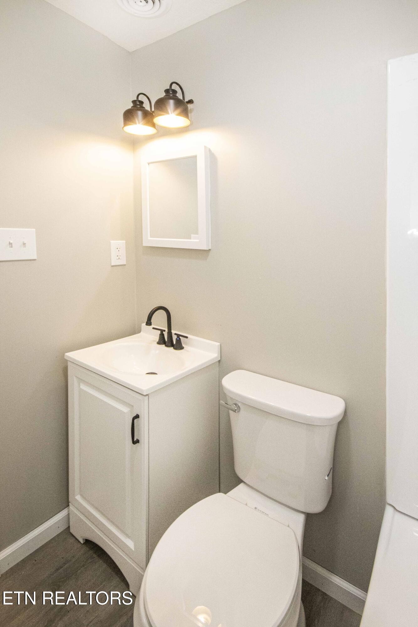 110 Delmar Circle Oak Ridge, TN 37830 - Photo 20 of 38 a white toilet sitting next to a bathroom sink