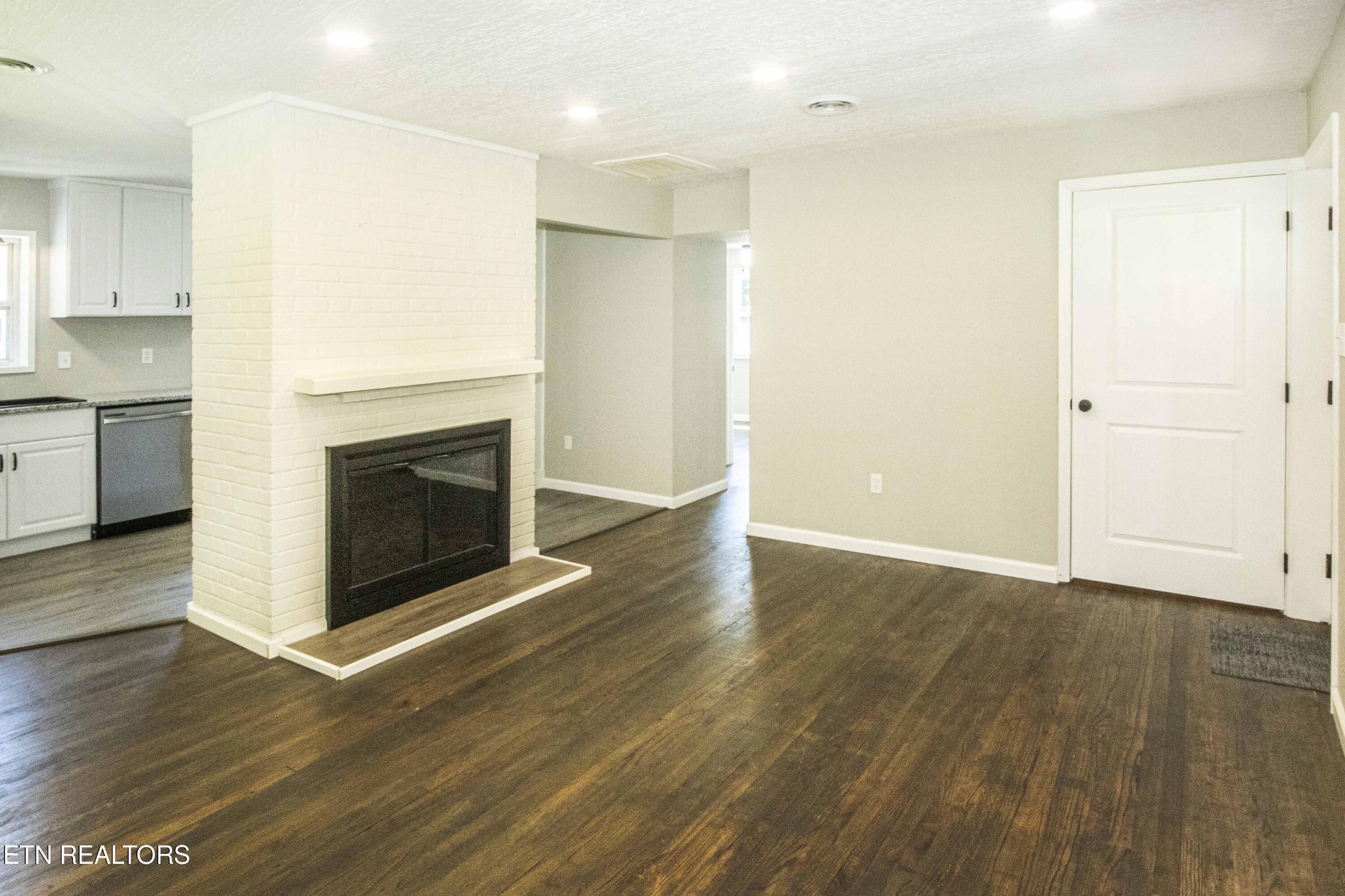 110 Delmar Circle Oak Ridge, TN 37830 - Photo 2 of 38 a view of a livingroom with wooden floor and a fireplace