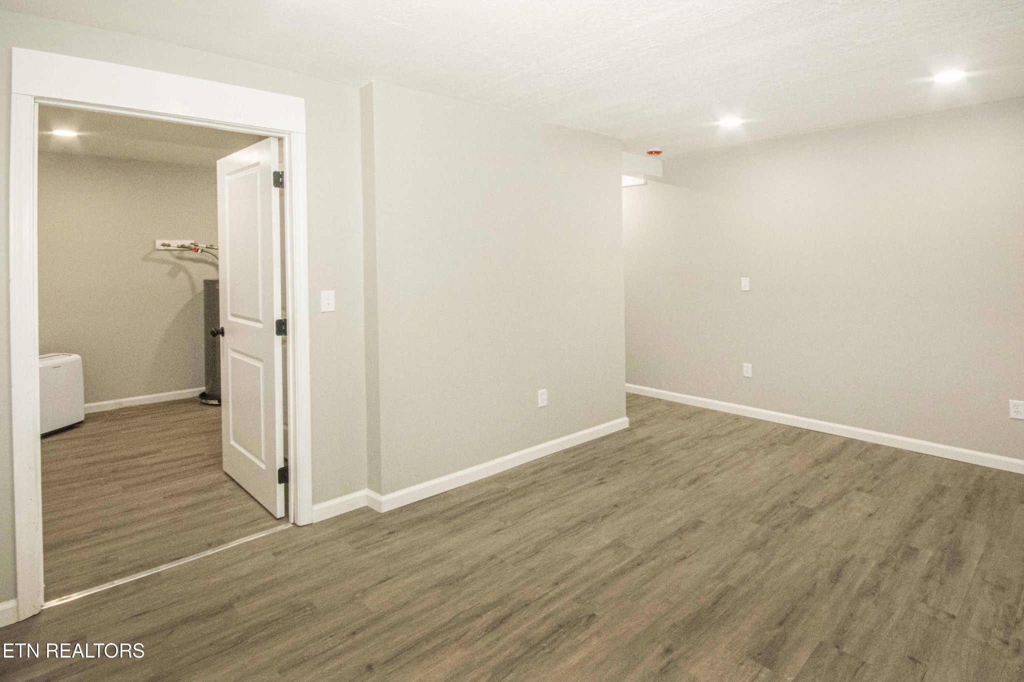 110 Delmar Circle Oak Ridge, TN 37830 - Photo 23 of 38 wooden floor in an empty room