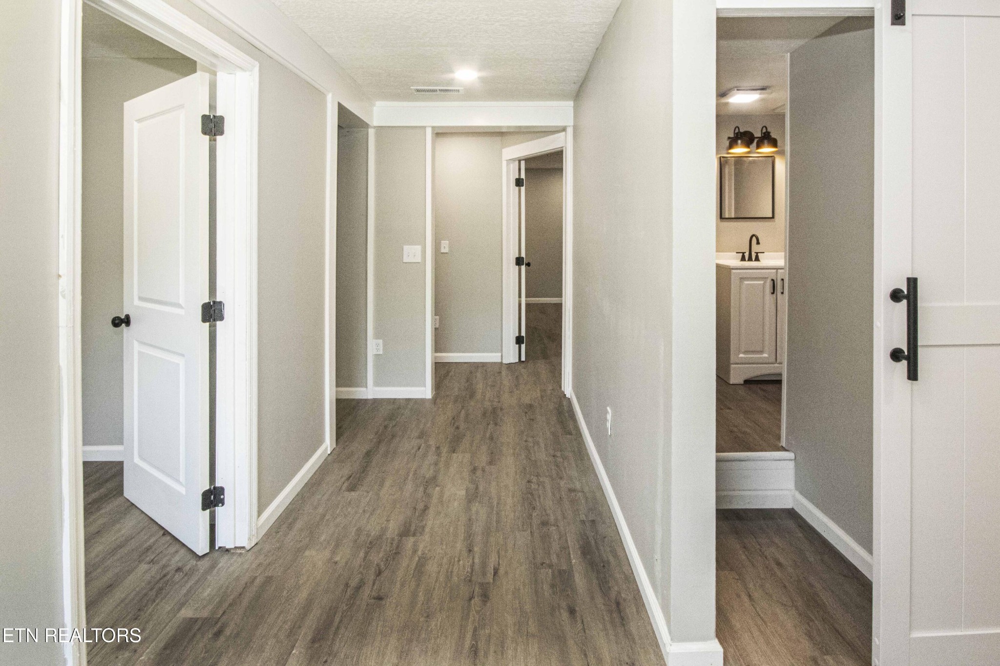 110 Delmar Circle Oak Ridge, TN 37830 - Photo 26 of 38 a view of a hallway with wooden floor and staircase