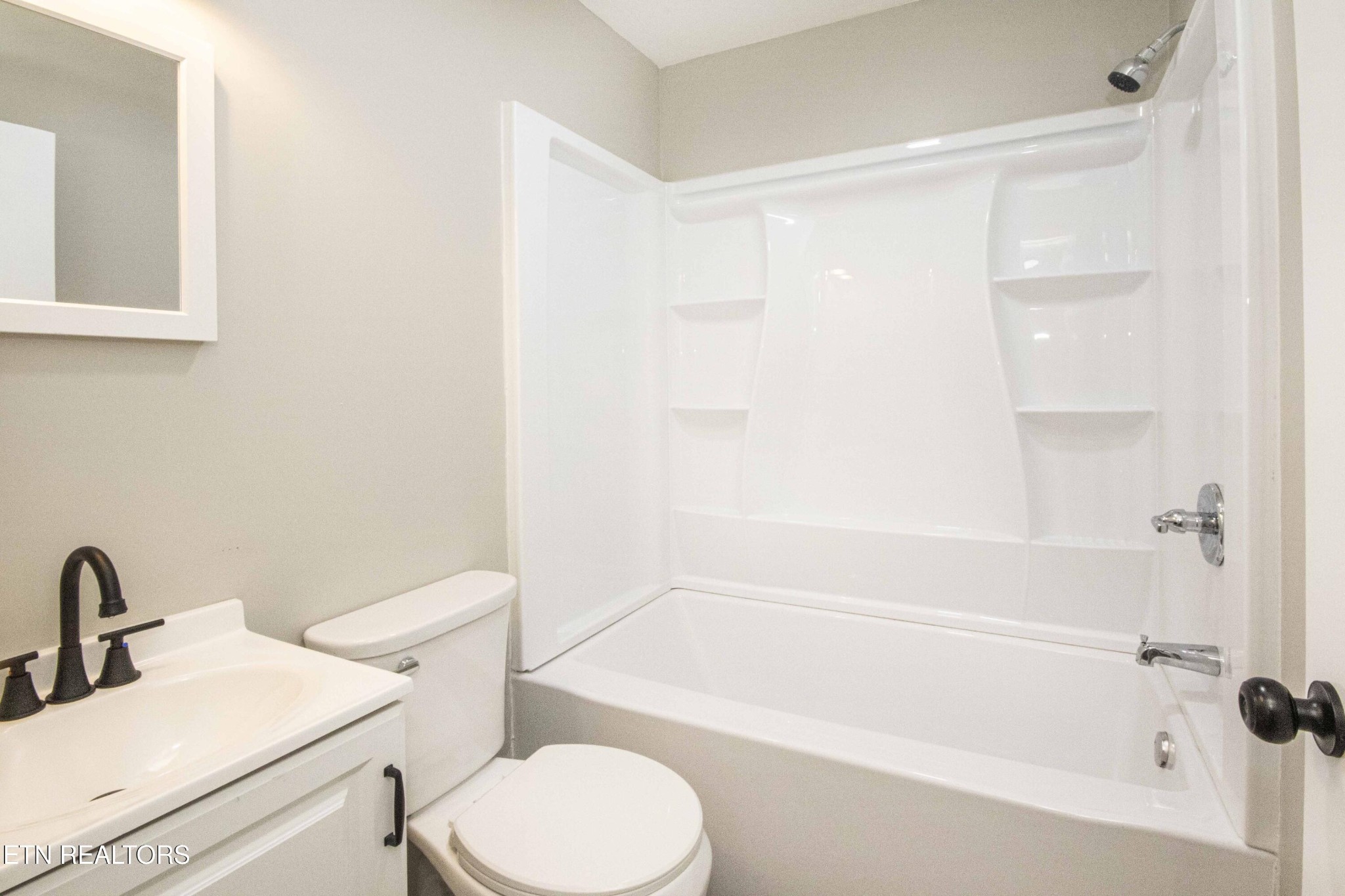 110 Delmar Circle Oak Ridge, TN 37830 - Photo 6 of 38 a bathroom with a sink a toilet and shower