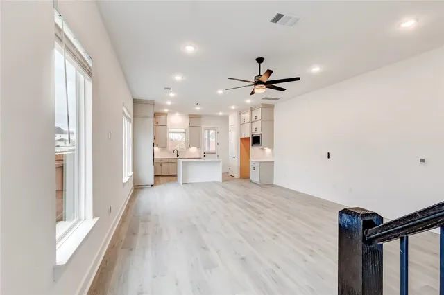 a view of a kitchen with a sink and a window