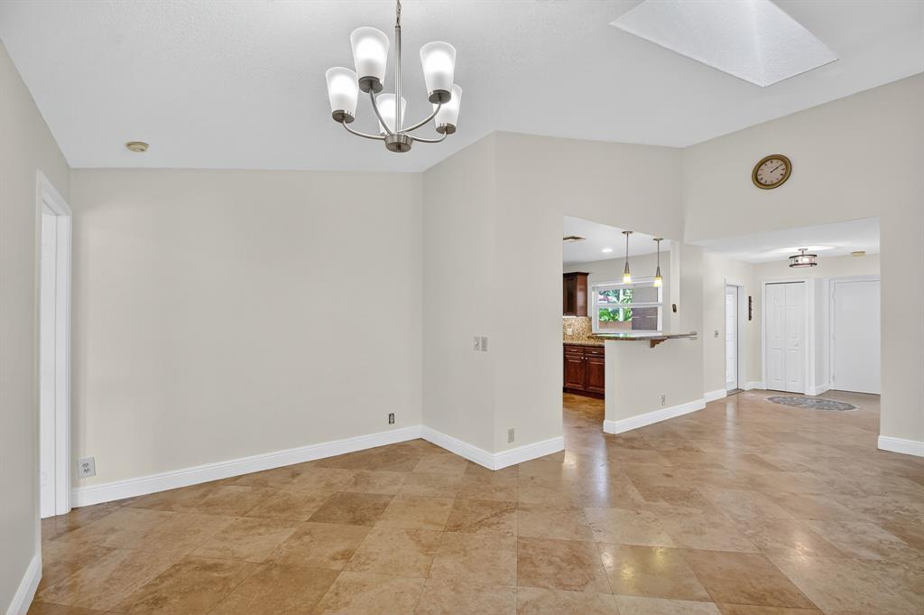 1620 Northwest 22nd Avenue Delray Beach, FL 33445 - Photo 19 of 63 a view of a kitchen with a sink and dishwasher cabinet