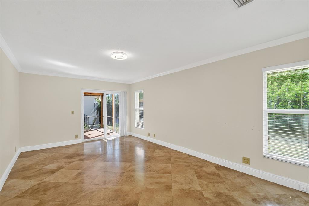 1620 Northwest 22nd Avenue Delray Beach, FL 33445 - Photo 20 of 63 wooden floor in an empty room with a window