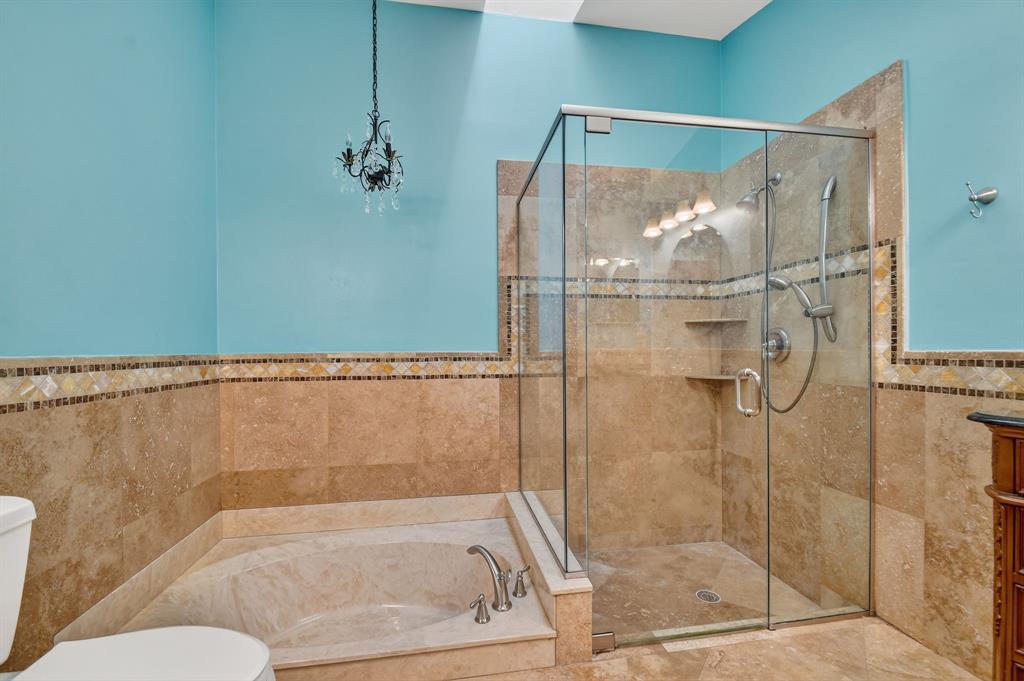 1620 Northwest 22nd Avenue Delray Beach, FL 33445 - Photo 26 of 63 a bathroom with a glass shower door