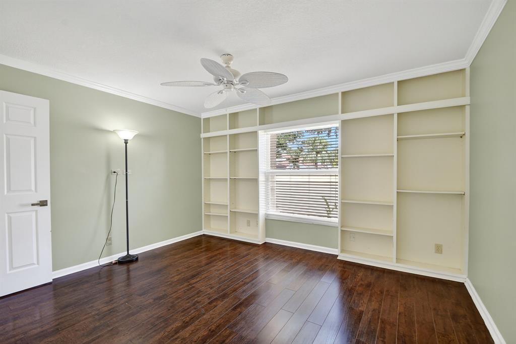 1620 Northwest 22nd Avenue Delray Beach, FL 33445 - Photo 35 of 63 an empty room with wooden floor closet and windows